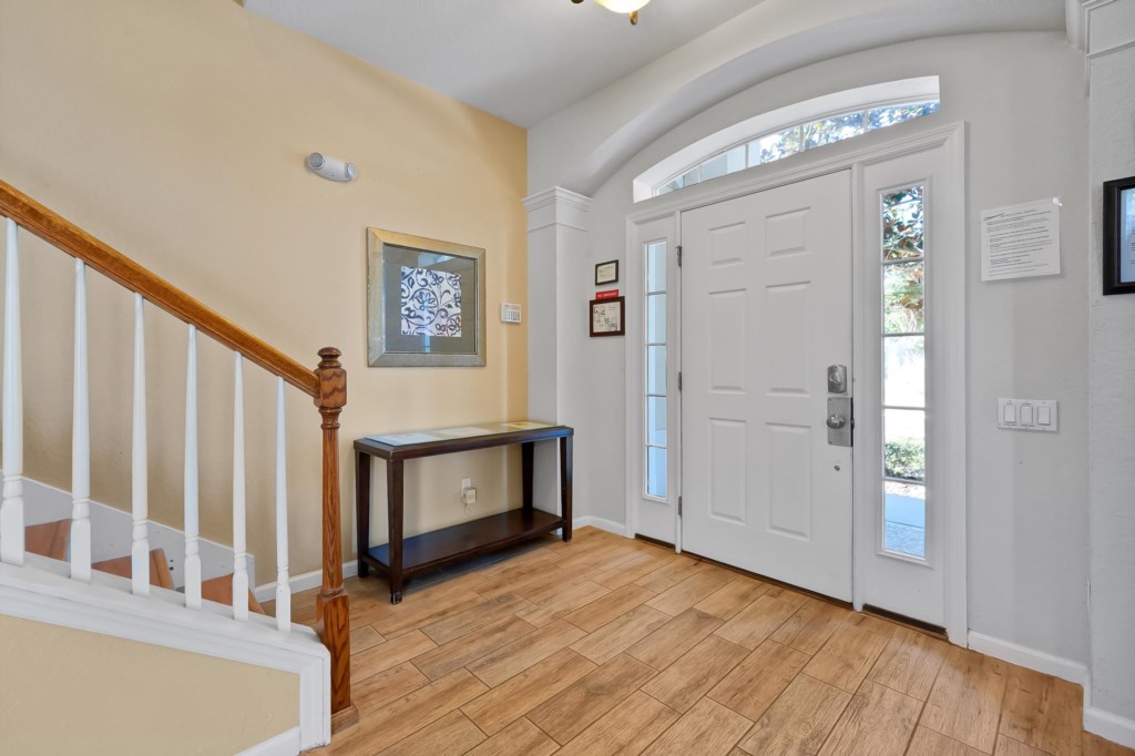 Welcoming entryway with natural light and convenient console table.