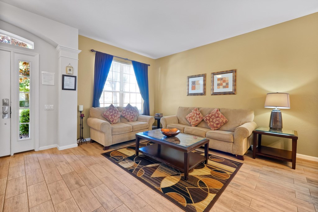 Inviting living room with cozy sofas, warm lighting, and stylish decor for relaxing evenings.