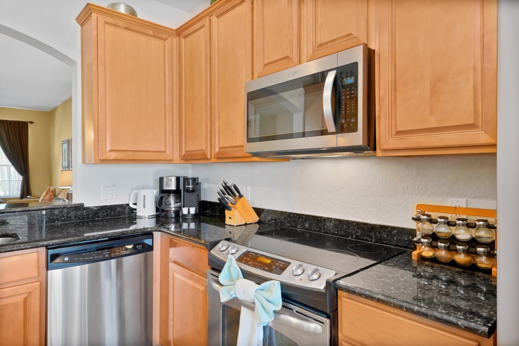 Modern kitchen with granite countertops and stainless steel appliances for gourmet cooking.
