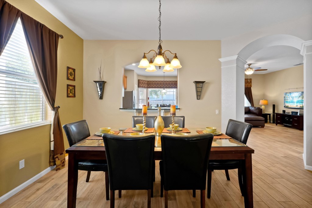 Elegant dining area with seating for six, perfect for family meals and gatherings.
