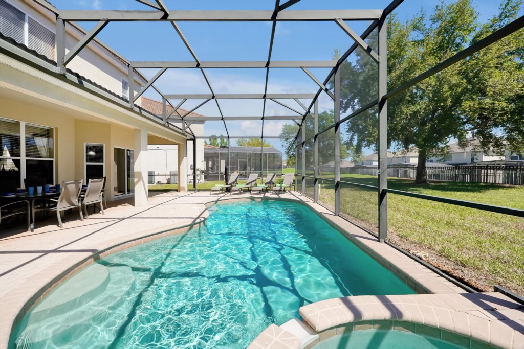 Private screened pool with sunny patio, perfect for relaxation and family fun.
