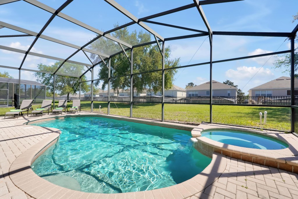 Private screened pool with sunny patio, perfect for relaxation and family  afternoon fun.