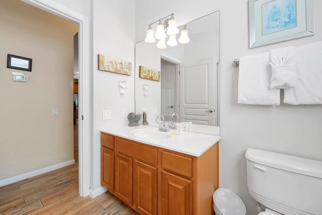 Bright bathroom with modern fixtures and fresh towels for your comfort.