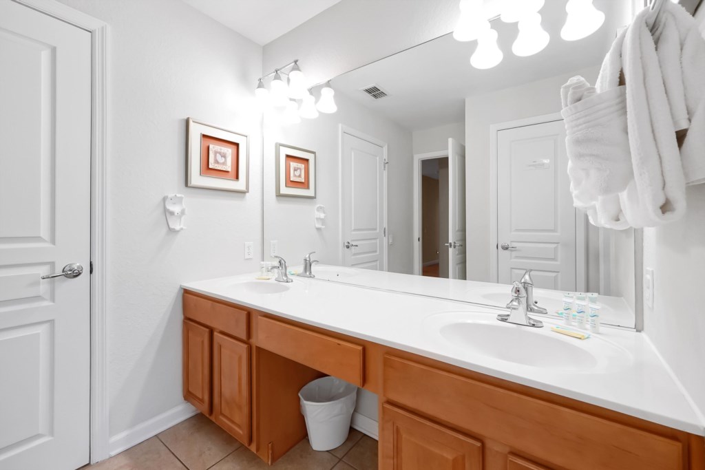Spacious bathroom with double sinks and bright lighting for a refreshing start to your day.