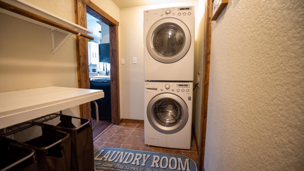 This is the laundry room with lots of space and a passage to the large family bedroom.