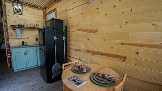 Mini-fridge and seating.