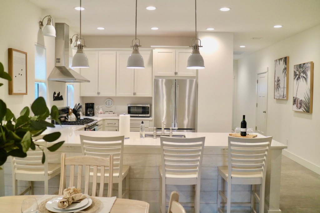 Great kitchen counter space with counter stools to hang out on. 