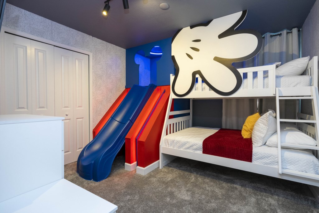 Disney themed bedroom w/ slide, full + twin bunk bed