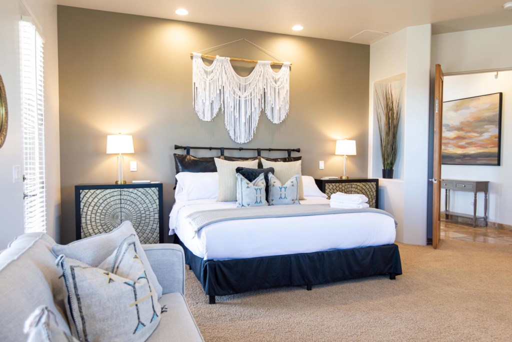 Tranquil colors lend a spa-like atmosphere to bedroom one featuring a king-size bed.