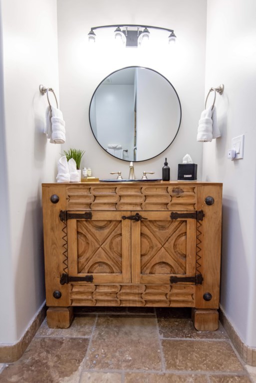 Rustic vanity lends a touch of the desert to this bathroom