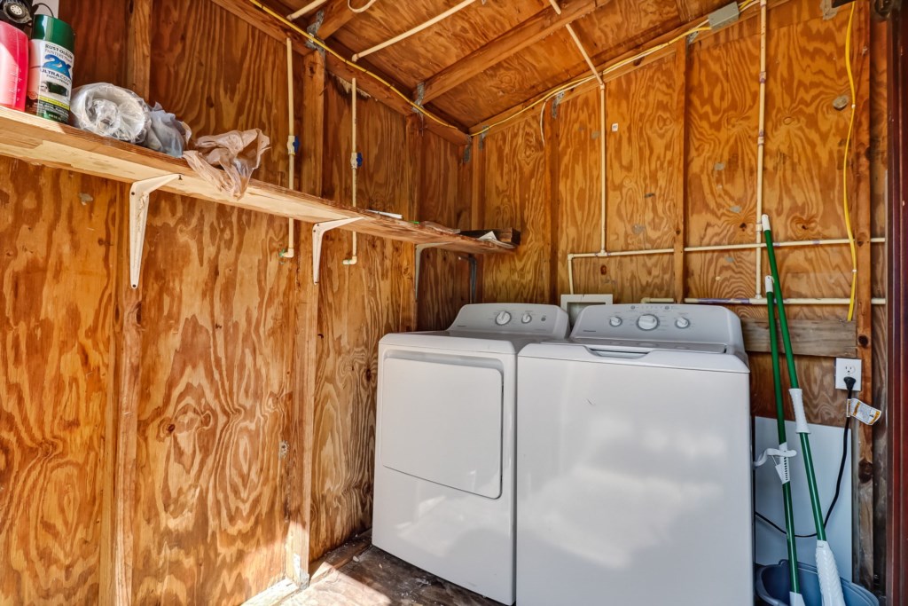 Laundry area. Located in building in backyard. 