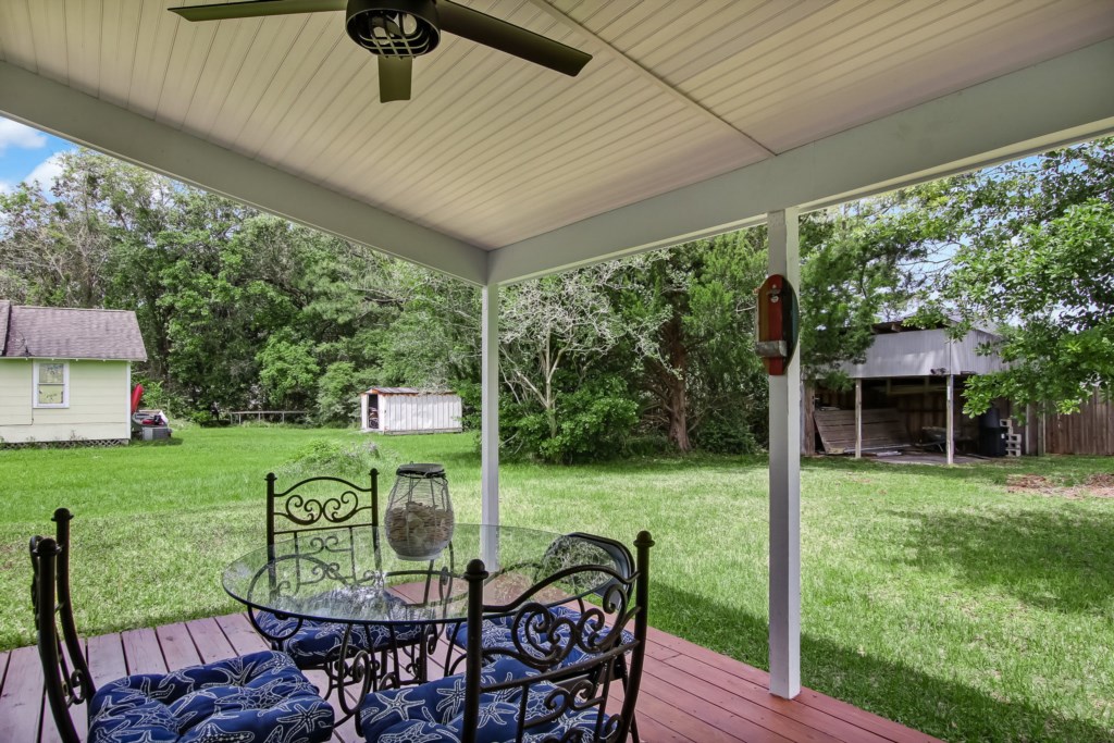 Covered porch with outdoor dining table