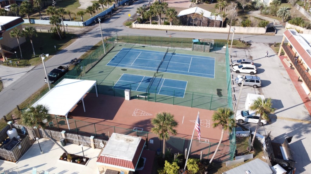Aerial view of tennis and basketball courts for active outdoor fun.