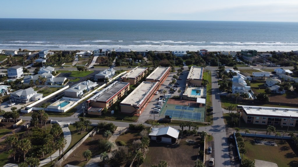 Aerial view of our beachside community, moments from the ocean.