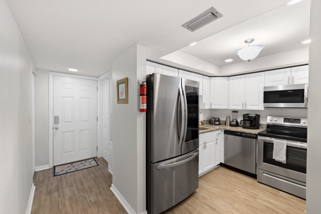 Modern, fully-equipped kitchen with stainless steel appliances.
