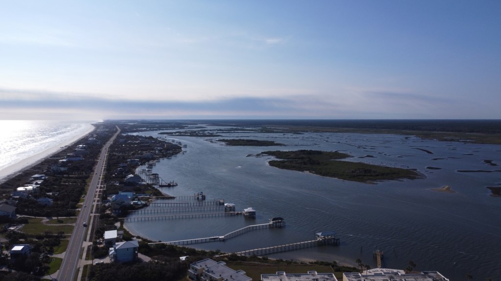 Aerial view of a serene coastal area, perfect for water activities.