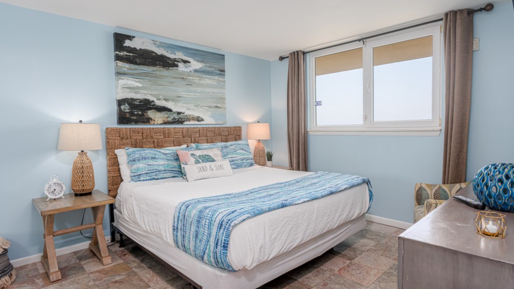 The bedroom offers a king size bed and a view of the Gulf of Mexico