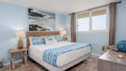 The bedroom offers a king size bed and a view of the Gulf of Mexico