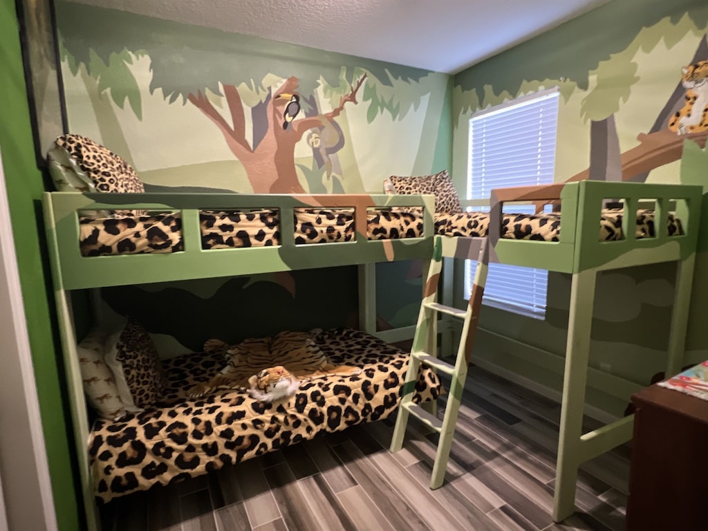 Jungle Cruise themed room has custom bunk beds and mural. 