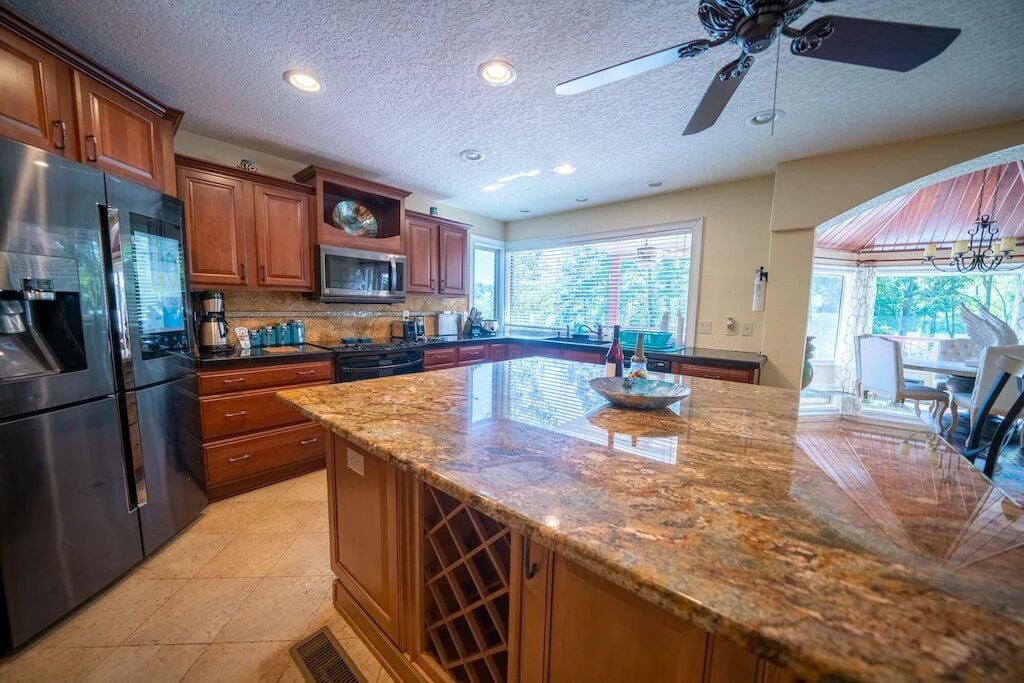 Large granite Island for meal prep, buffets, or just a casual hangout.
