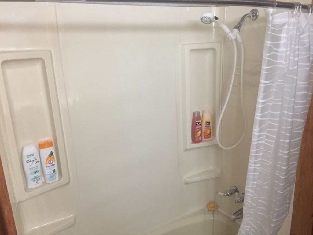 Curved Shower Rod to give more room inside.