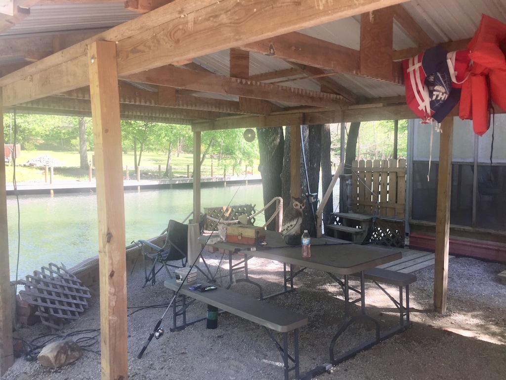 Covered Shared Area Picnic Table. Use this spot to fish from or clean them.