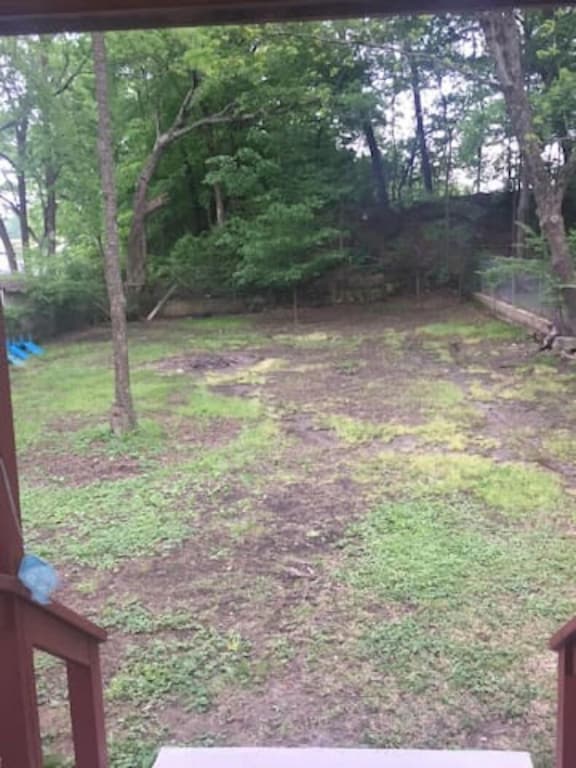 Large fenced backyard, with Fire Pit, seen from the back deck off the kitchen.