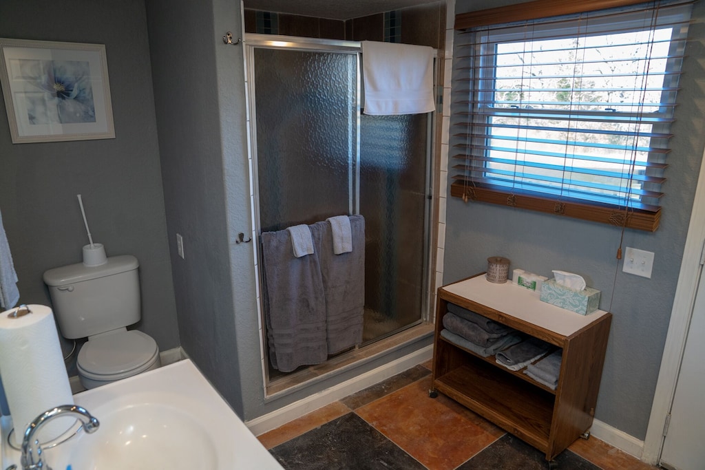 Adjoining Full Bathroom to card room, also with door to back deck.