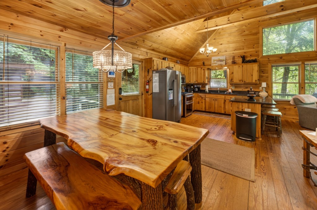 Rustic kitchen with natural wood finishes and a handcrafted dining table, ideal for cozy cabin meals.