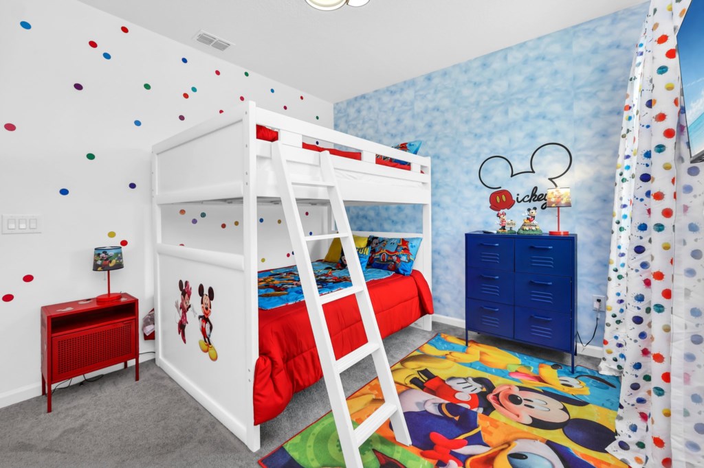 Mickey's Playhouse themed room with two full beds