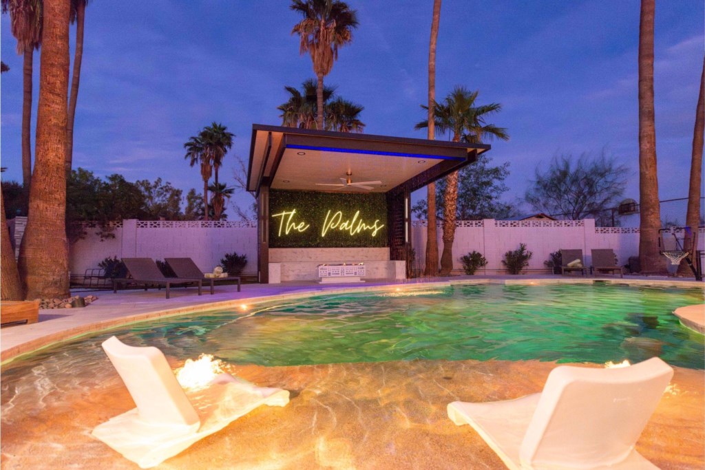 The Palms . Please note the firepit isn’t working under neon sign 