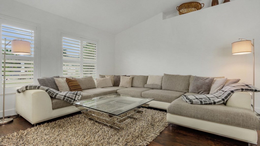 Spacious living area with a cozy sectional sofa, perfect for relaxation.