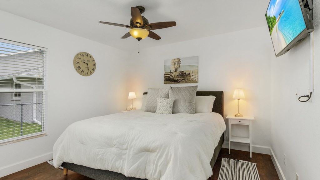 Cozy bedroom with soft lighting and neutral tones for a peaceful retreat.