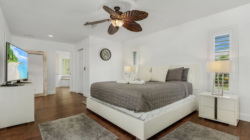 Spacious master bedroom with stylish decor and plenty of natural light.