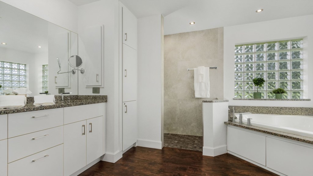 Spacious bathroom with double vanities and modern fixtures.