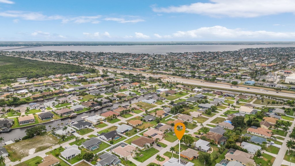 Stunning aerial view of the neighborhood with close proximity to water and amenities.