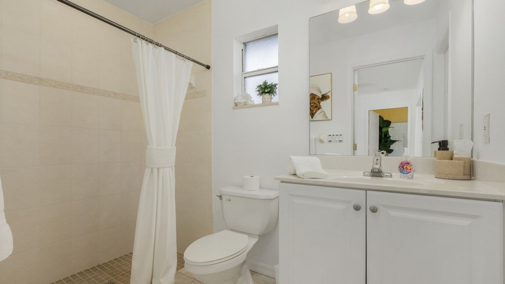 Clean and modern bathroom with a walk-in shower for a refreshing experience.