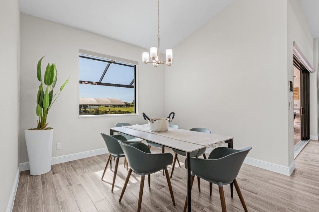 Cozy dining area with natural light and beautiful views, perfect for intimate meals.