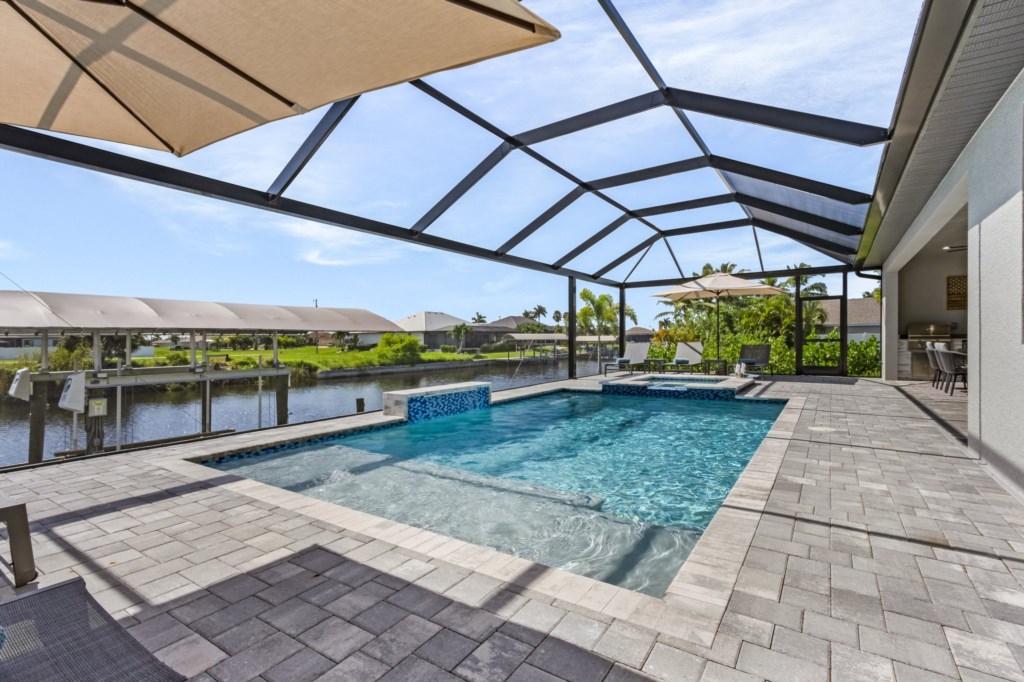 Relax by the pool with beautiful water views and ample sunbathing space.