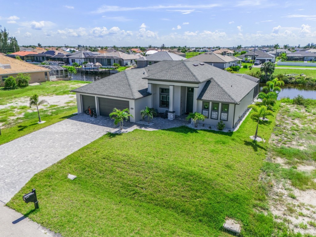 Beautiful aerial view of the home, showcasing the expansive yard and modern design.