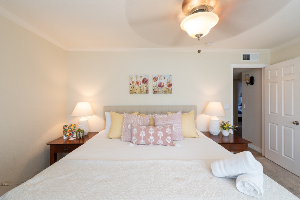 Inviting bedroom with plush bedding and soothing decor for a restful night's sleep.