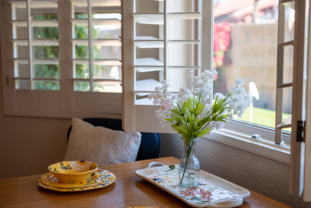 Cozy breakfast nook with garden views, perfect for morning coffee and relaxation.