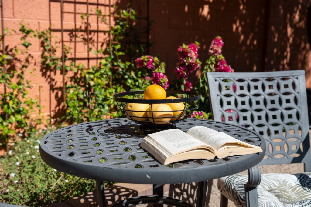Charming patio nook perfect for reading and relaxing with garden views.