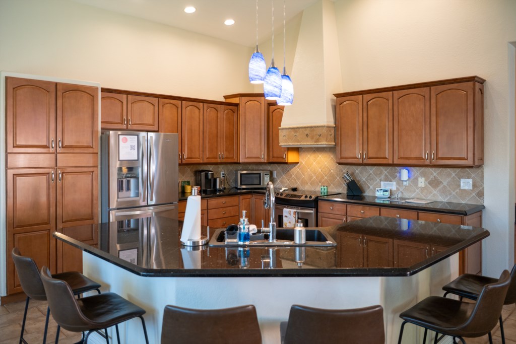 Spacious kitchen with modern appliances and a large island for family gatherings.