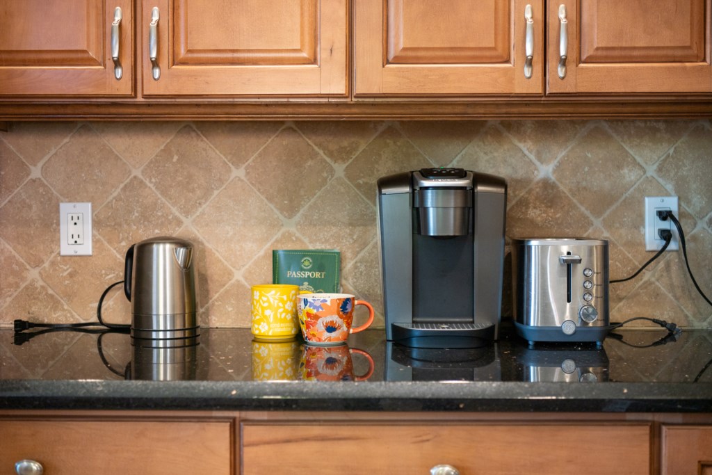 Fully equipped kitchen with coffee maker, kettle, and toaster for a perfect morning start.
