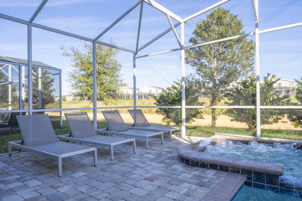 Private swimming pool with lounge chairs