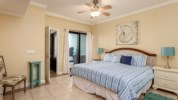 The master bedroom has a king bed with a view of the Gulf of Mexico