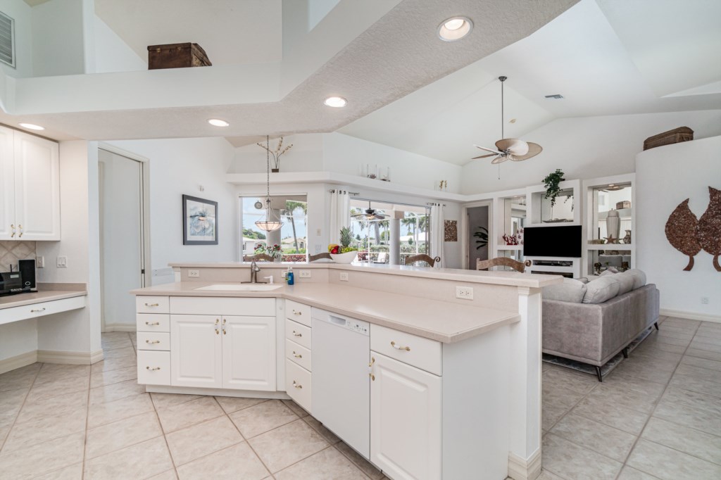 Modern, open-plan kitchen with a large island, seamlessly transitioning into a comfortable living area.
