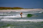 Watch the surfers catch some waves