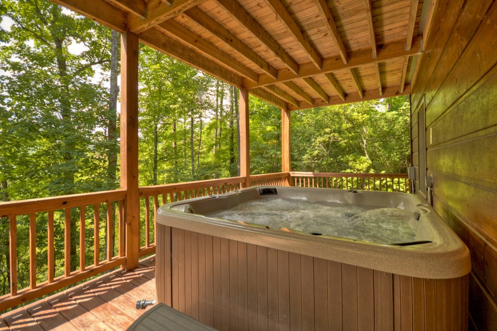 Enjoy a soak in Huckleberry Trails relaxing hot tub